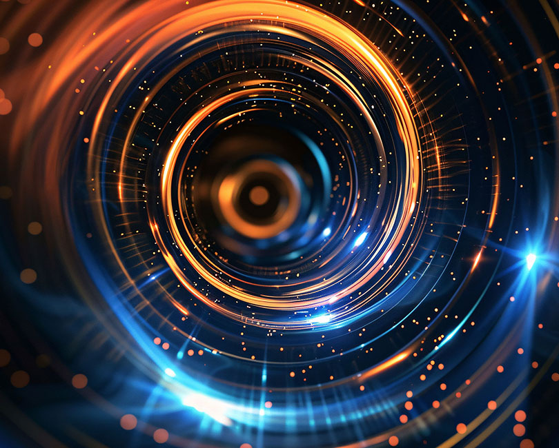 A dynamic swirl of vibrant orange and blue light trails creates a tunnel-like effect, with glowing particles scattered throughout the dark background, giving a sense of motion and energy.